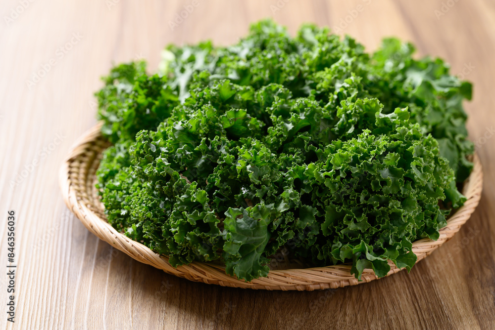 Green Kale or leaf cabbage in basket on wooden background, Healthy vegetable Green Kale or leaf cabbage in basket on wooden background, Healthy vegetable