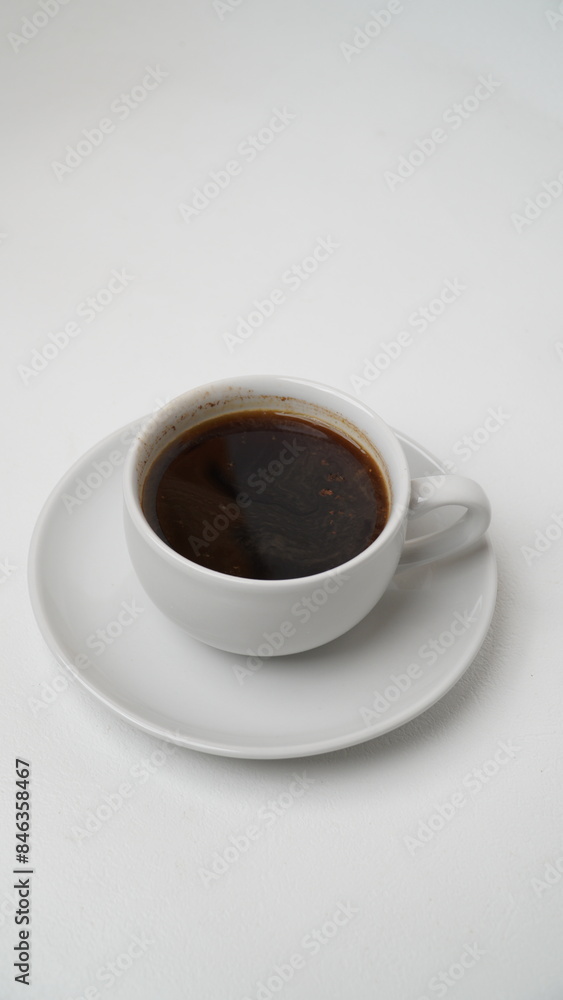 A glass of black coffee in a white glass isolated on a white background
A glass of black coffee in a white glass isolated on a white background
