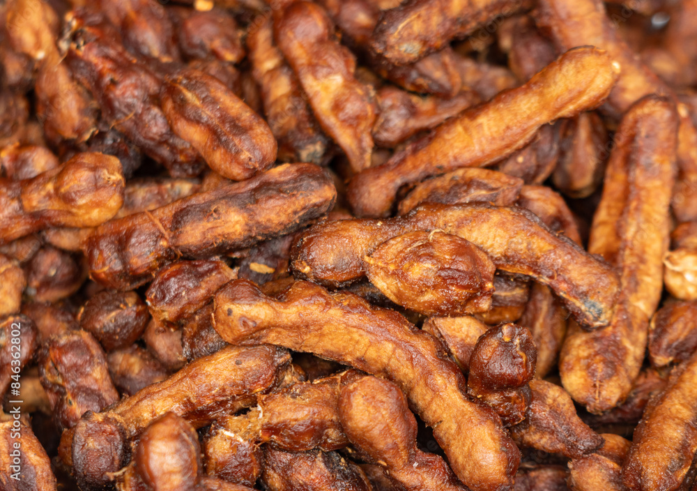 peeled tamarind fruits as background. peeled tamarind fruits as background.