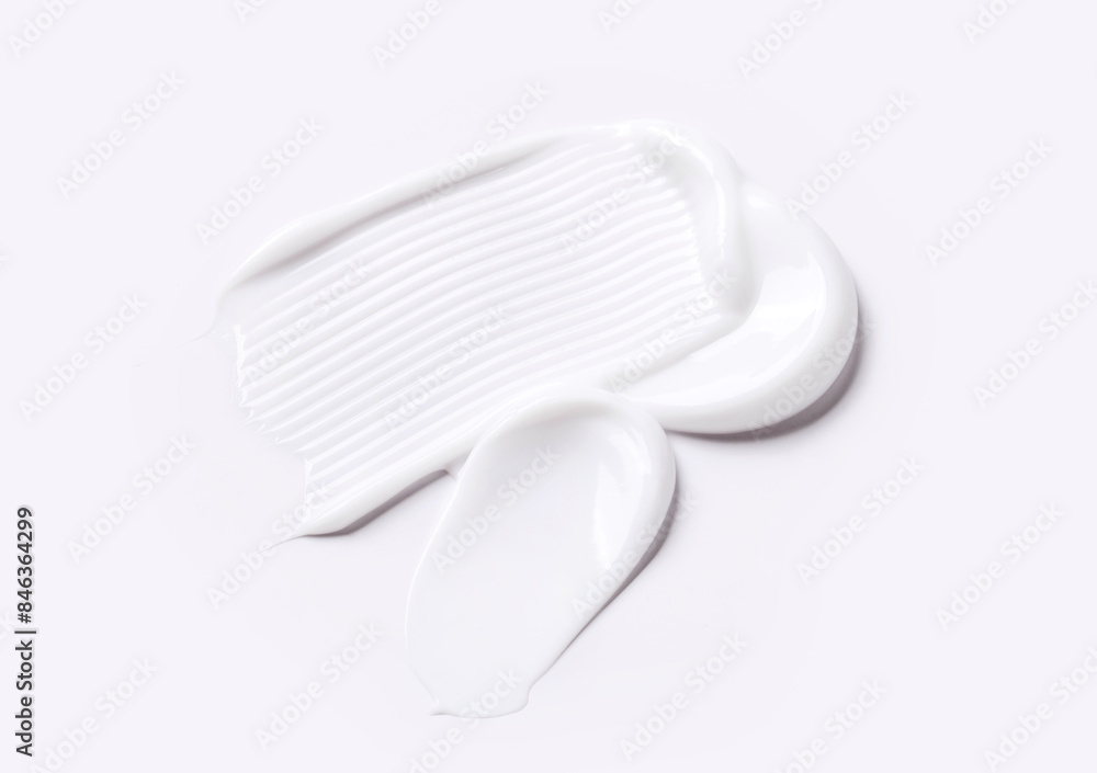 samples of cosmetic care products smear of cream texture on a light background samples of cosmetic care products smear of cream texture on a light background