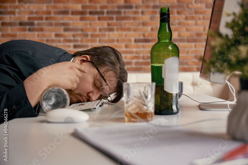 Tableau sur toile Businessman drunkard sleeping at desk in home office workplace