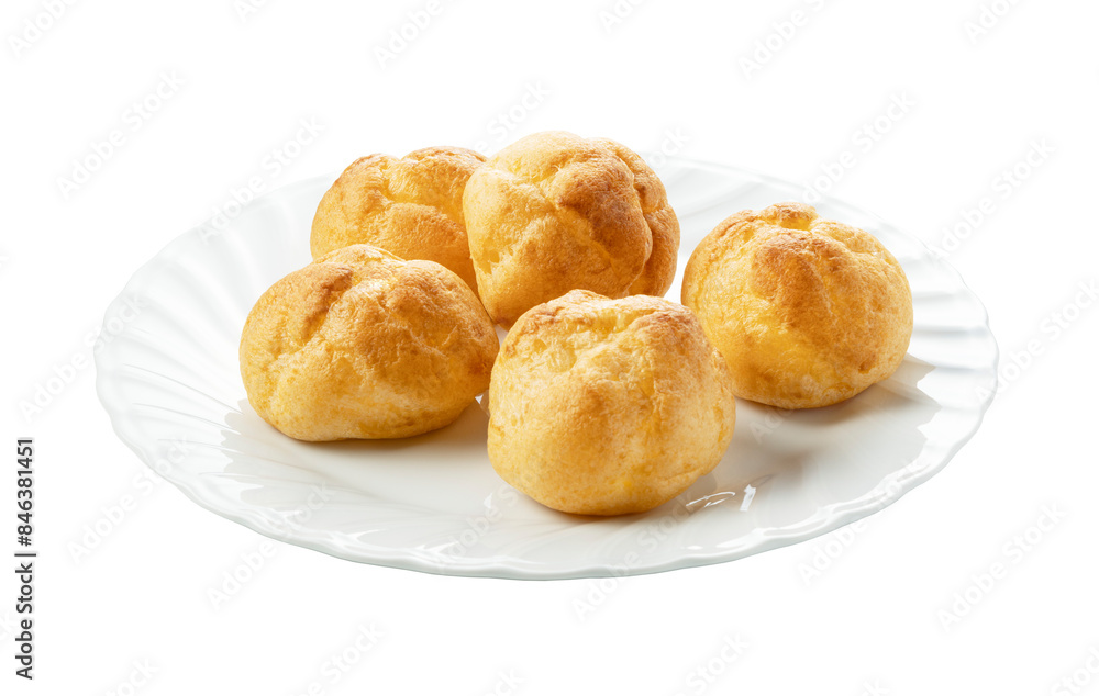 Cream puffs on a plate placed on a white background. Cream puffs on a plate placed on a white background.