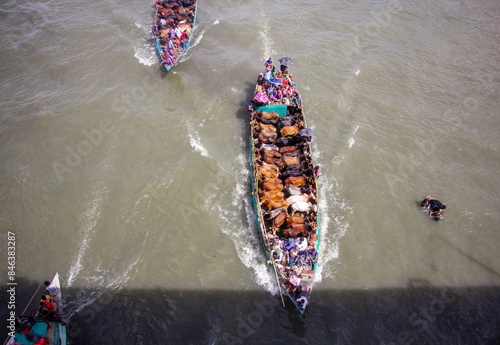 Some images can't be discribed.some moment has'nt any explanation.This captur is such kind of them.
In this picture we can see that a full of boat is on the way of a hat. photo