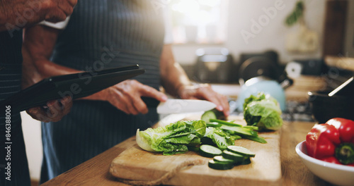 Foto Hands, tablet and salad recipe in kitchen with help, support and teaching at home for healthy food