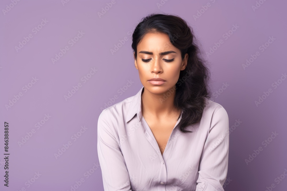 Sad woman, 45, Hispanic, dealing with family issues, on a pastel light purple background Sad woman, 45, Hispanic, dealing with family issues, on a pastel light purple background