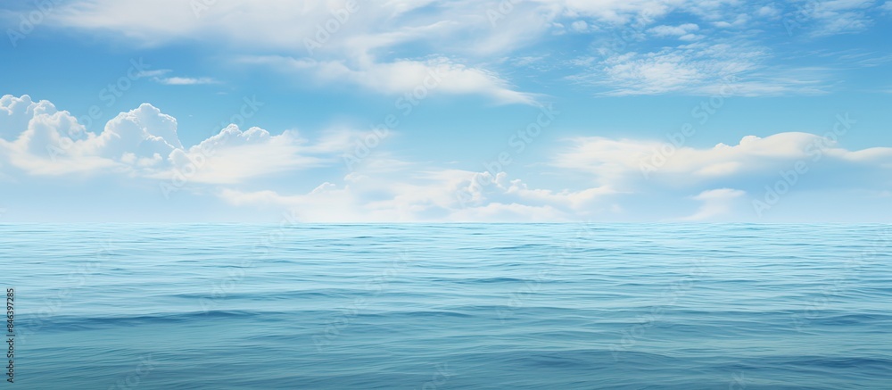 Obraz premium A copy space image is available with a cloudy sky and a calm clear ocean