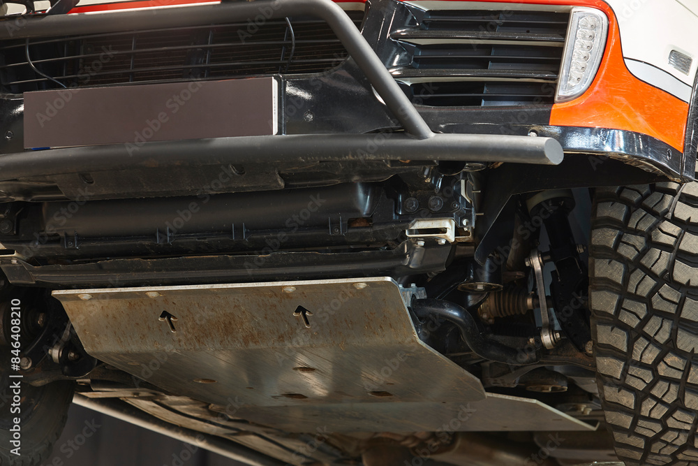 All terrain car wheel detail from below. Off road driving. All terrain car wheel detail from below. Off road driving.
