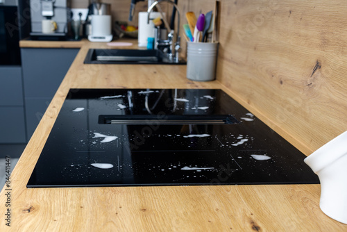 Detergent stains on the stove, cleaning, washing the stove, cleaning the kitchen