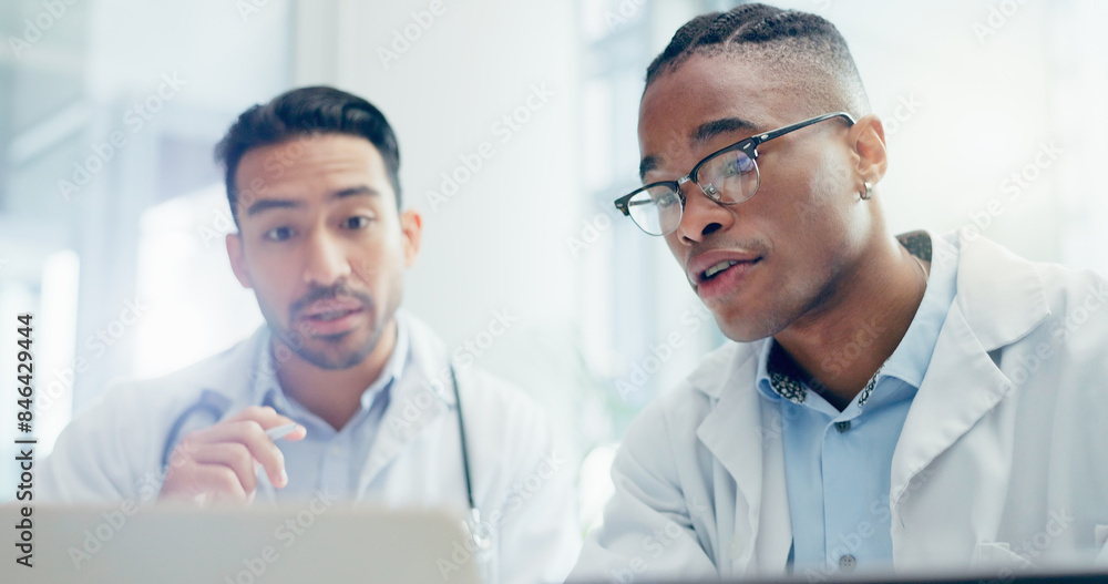 Meeting, doctors and men in clinic with laptop for discussion, treatment plan or diagnosis. Talking, healthcare and medical professionals with technology for conversation, teamwork or collaboration Meeting, doctors and men in clinic with laptop for discussion, treatment plan or diagnosis. Talking, healthcare and medical professionals with technology for conversation, teamwork or collaboration