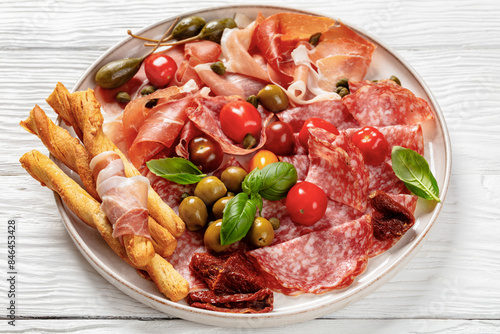 Photography italian antipasto plate of cured meat and veggies