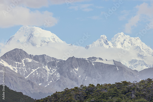 Snow capped mountains of the Andes across the Chilean border, seen from the Beagle Channel near Ushuaia photo