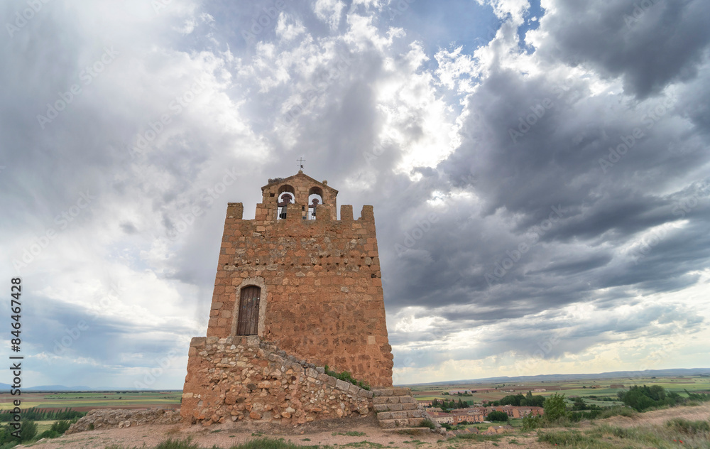 Wide-angle view of the Martina Tower in the foreground, with the medieval town of Ayllon. Wide-angle view of the Martina Tower in the foreground, with the medieval town of Ayllon.