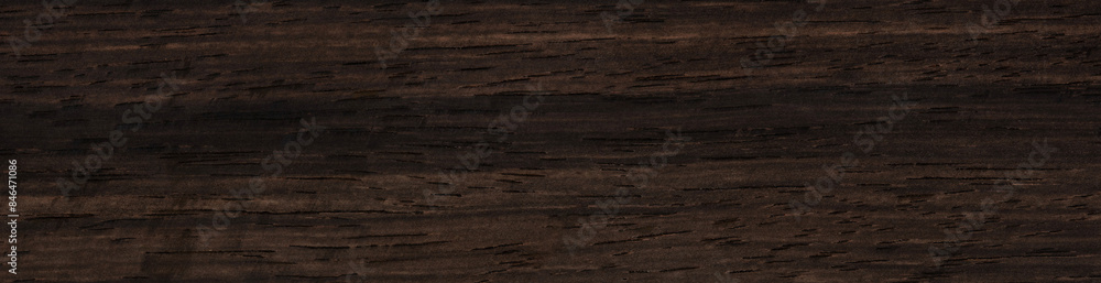 Ebony veneer surface with dark, enigmatic streaks and subtle texture Ebony veneer surface with dark, enigmatic streaks and subtle texture