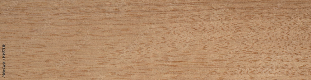 Warm Tanganica veneer wood surface with natural grain and texture Warm Tanganica veneer wood surface with natural grain and texture