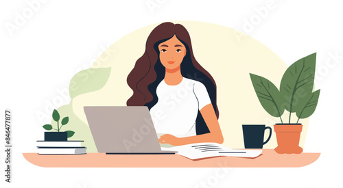 A woman is sitting at a desk with a laptop and a cup of coffee