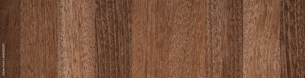 Naklejka premium Rich Vinterio mahogany veneer showcasing deep wood grains