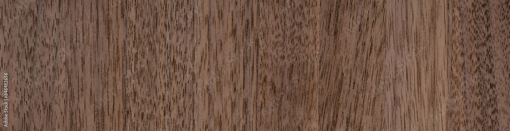 Naklejka premium Warm Canaletto walnut veneer with intricate wood patterns