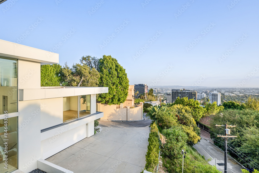 Fototapeta premium Spacious balcony with a wide window overlooking A cityscape