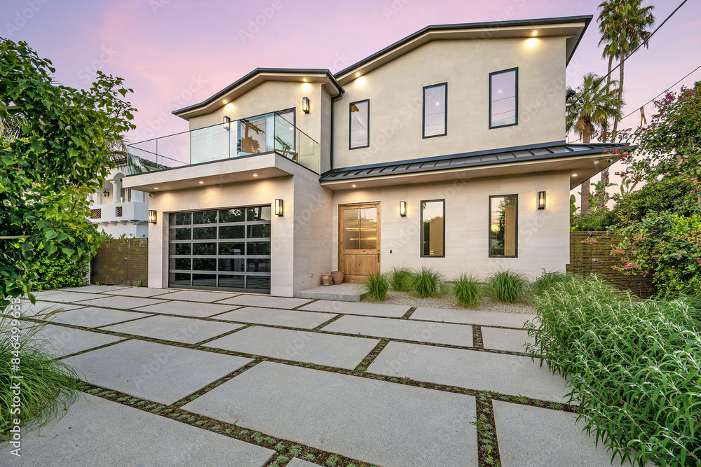 House with a tiled driveway and lush greenery in the garden. California, USA House with a tiled driveway and lush greenery in the garden. California, USA