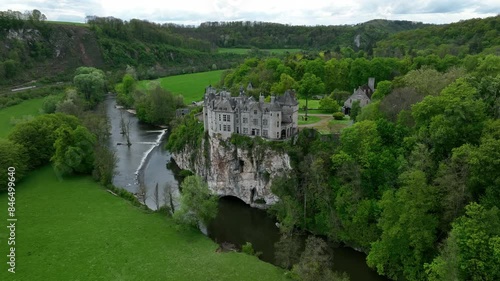 Aerial footage of Walzin Castle on a hill over the river Lesse in Dinant, Walloon Region, Belgium photo