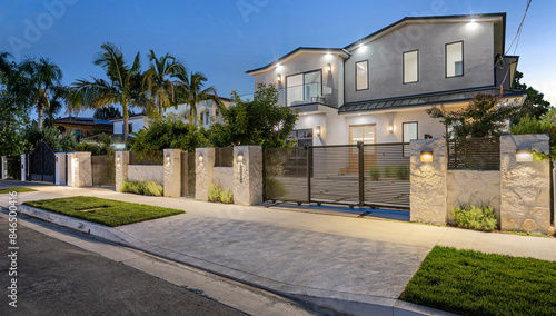 Valokuva House with a beautiful garden and metal gates. California, USA
