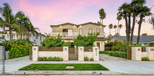 House with a beautiful garden and metal gates. California, USA