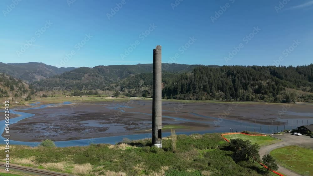 Drone shot of Garibaldi, Oregon, featuring a stunning column stack near the bay. Drone shot of Garibaldi, Oregon, featuring a stunning column stack near the bay.