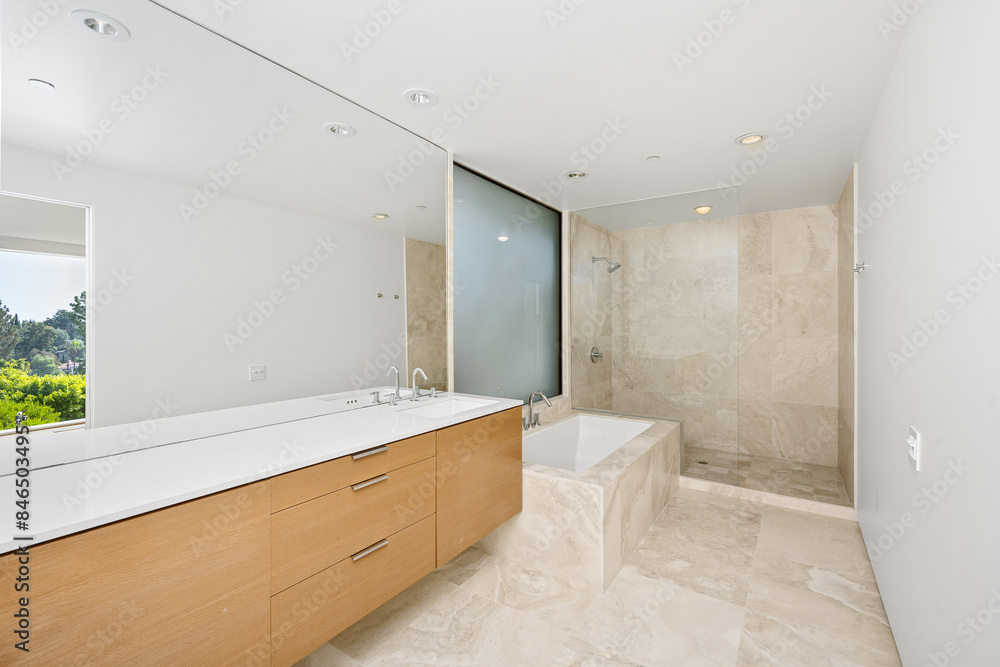 Fototapeta premium Spacious bathroom with marble floor and beige walls