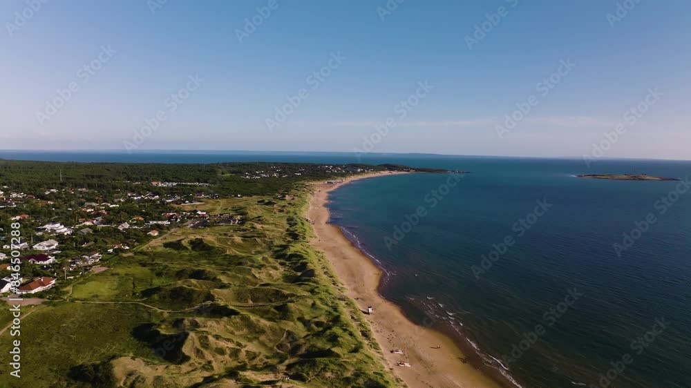Push in drone view of beach, greenery and sea on sunny summer day Push in drone view of beach, greenery and sea on sunny summer day