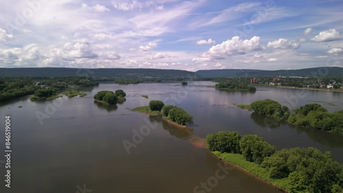 Drone footage of Susquehanna River flowing in Harrisburg city on a sunny day in Pennsylvania, USA