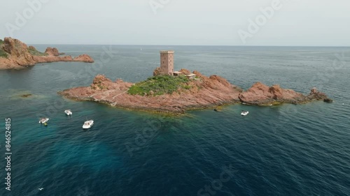 Aerial shot of an island in the sea in Le Dramont, France. Il d'Or castle is located on the island. photo