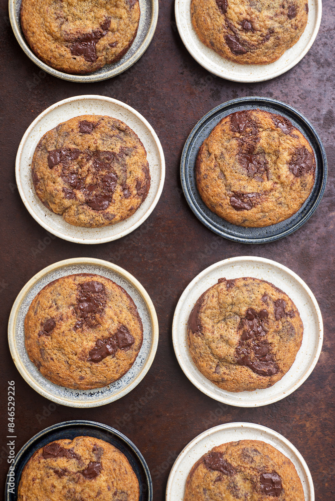 Homemade chocolate chip cookies in ceramic plates on rustic background. Homemade chocolate chip cookies in ceramic plates on rustic background.