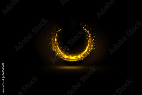 Magical light effect. Rotating luminous ellipses. Dynamic golden rings on black background.