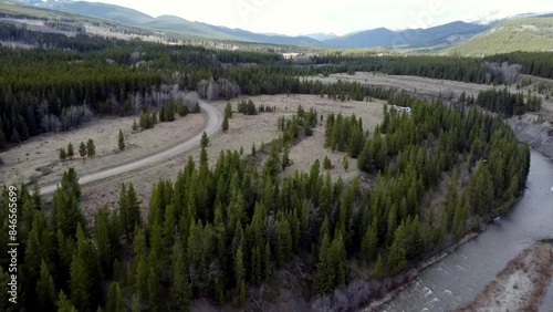 Large mountain range with trees in the foreground