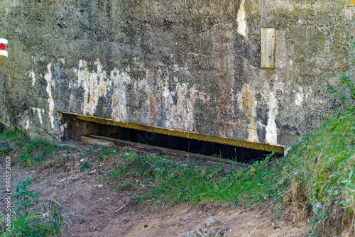 Artillery bunker fortification at hiking trail at Swiss mountain pass St. Gotthard on a sunny summer day. Photo taken September 10th, 2023, Gotthard Pass, Switzerland.