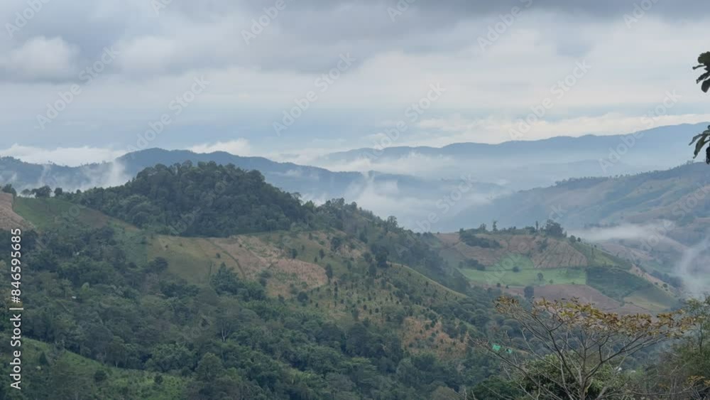 Morning fog is forming and rising above the mountains. Morning fog is forming and rising above the mountains.