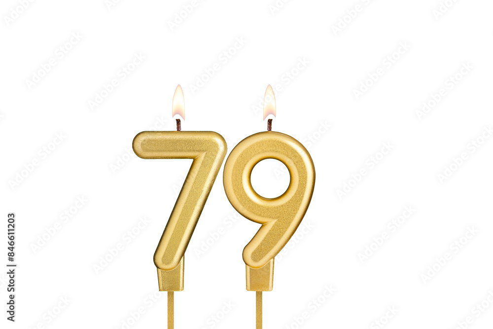Golden number 79 birthday candle on white background Golden number 79 birthday candle on white background