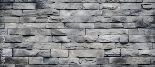 Close-up grey brick wall ba...
