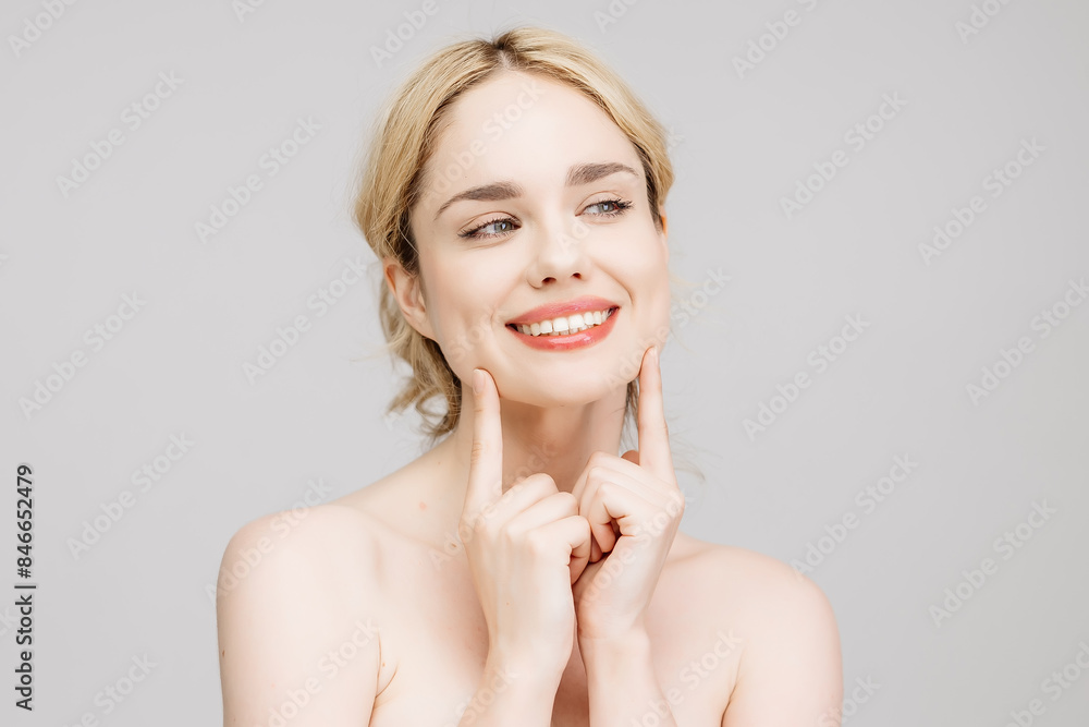 Close-up portrait of a charming half-naked woman in the studio. Portrait of a charming, sensual blonde on a light background. Cosmetology concept. Close-up portrait of a charming half-naked woman in the studio. Portrait of a charming, sensual blonde on a light background. Cosmetology concept.