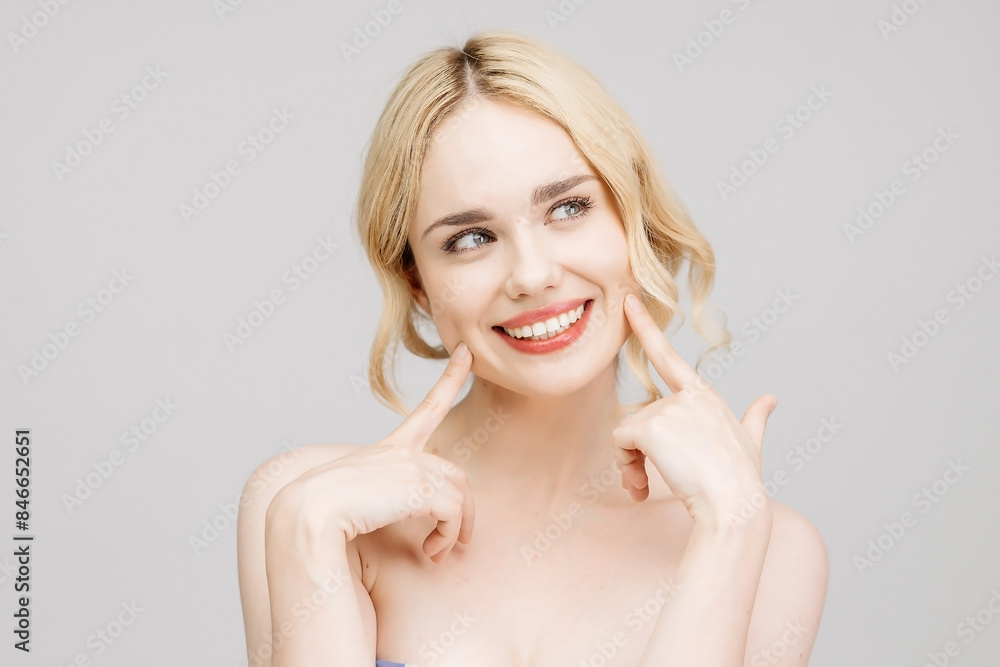 Close-up portrait of a charming half-naked woman in the studio. Portrait of a charming, sensual blonde on a light background. Cosmetology concept. Close-up portrait of a charming half-naked woman in the studio. Portrait of a charming, sensual blonde on a light background. Cosmetology concept.