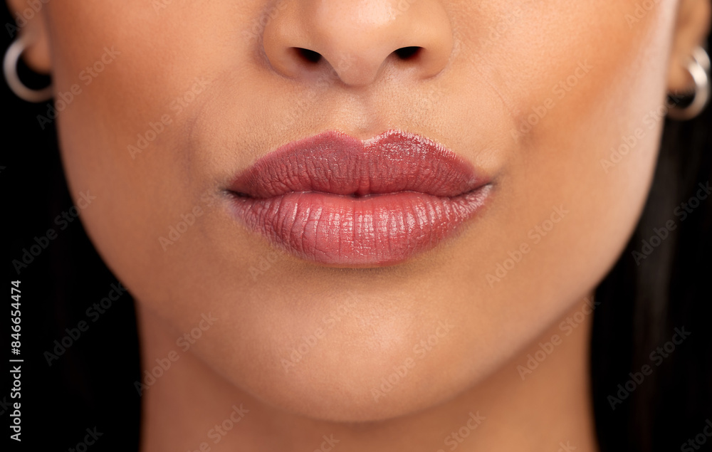 Obraz premium Woman, mouth and lipgloss for beauty in studio, textures and skincare on black background. Female person, lips and shine for filler or dermatology, treatment and skin textures for grooming or glow