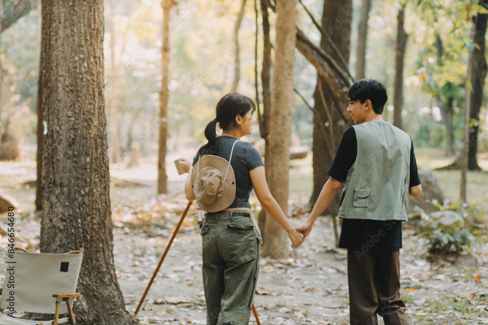 Asian couple sweet in tent inside on they camping trip, traveller relax and sleep togather in out door and camping trip Asian couple sweet in tent inside on they camping trip, traveller relax and sleep togather in out door and camping trip
