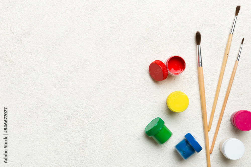 art palette with paint and brushes, close up. Top view with empty space. workplace for creativity. home teaching concept drawing art palette with paint and brushes, close up. Top view with empty space. workplace for creativity. home teaching concept drawing