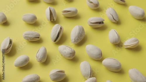 Wallpaper Mural Pistachios lay on a beautiful sunny yellow background. Torontodigital.ca