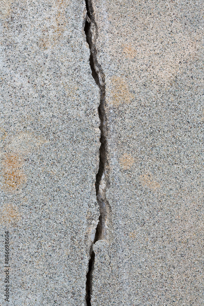 Fototapeta premium Deep crack in an old brick wall with damaged plaster