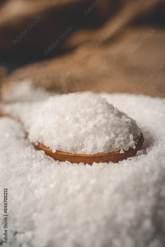 Wooden spoon with salt, close-up Wooden spoon with salt, close-up