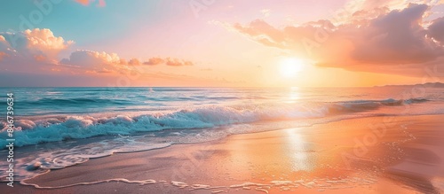 Vibrant sunrise on the beach by the ocean.