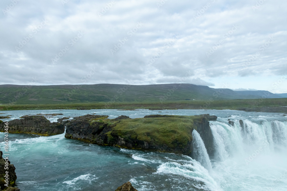 Iceland Akureyri landcape with waterfall on the river on a sunny day Iceland Akureyri landcape with waterfall on the river on a sunny day