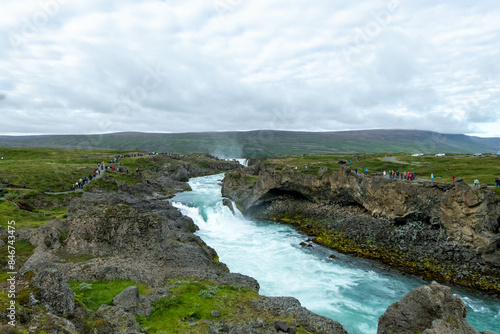 Iceland Akureyri landcape with waterfall on the river on a sunny day