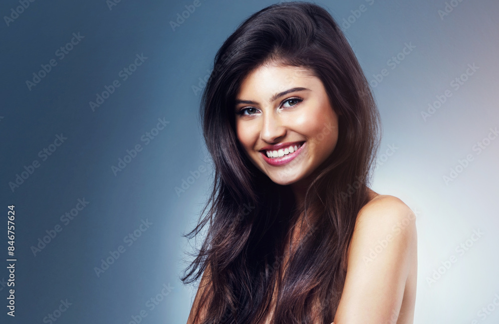 Woman, portrait and smile in studio for skincare, beauty and luxury spa treatment on blue background. Girl, happy and confidence with healthy skin, self care and wellness with facial transformation Woman, portrait and smile in studio for skincare, beauty and luxury spa treatment on blue background. Girl, happy and confidence with healthy skin, self care and wellness with facial transformation
